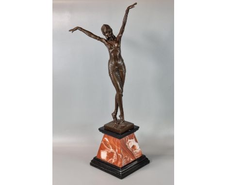 After Chiparus, an Art Deco style bronze figure, a nude dancer, with foundry mark, signed with number A7255, on a veined marb