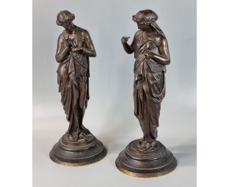 Pair of 19th century French bronze neoclassical female figures, one holding a book marked 'Ciencia', the other with a butterf