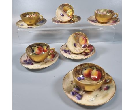 Six Royal Worcester demi-tasse porcelain cups and saucers, hand painted with fruit, signed Ricketts and T Lockyer. Early 20th