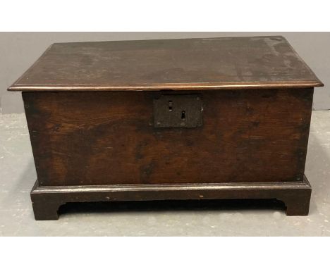 Late 18th century Welsh oak coffwr bach of plain rectangular form with iron plate lock, on a projecting base and bracket feet