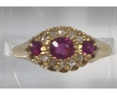 18ct gold diamond and ruby ring. 2.5g approx. Size P. (B.P. 21% + VAT)  Rather grubby.  All stones are present.  Noticeable s
