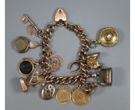 9ct gold curb link charm bracelet with assorted charms including: Masonic, harp, Intaglio seal fobs and bloodstone fobs, hors