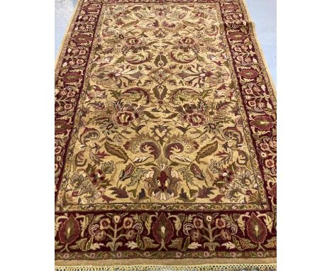 Full wool pile handmade Indian tea washed Agra carpet, overall decorated with floral designs and repeating rich floral and fo