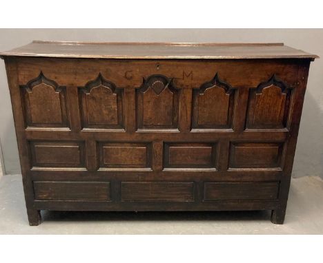 18th century Welsh oak coffer, probably Cardiganshire, the moulded top above five ogee pointed fielded panels, one with shell