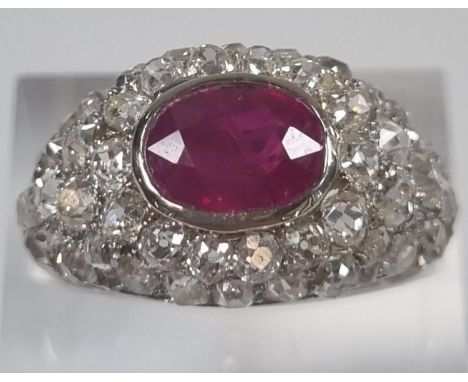 Platinum, ruby and diamond bombe ring.  6.5g approx.  Size O 1/2.  (B.P. 21% + VAT) 