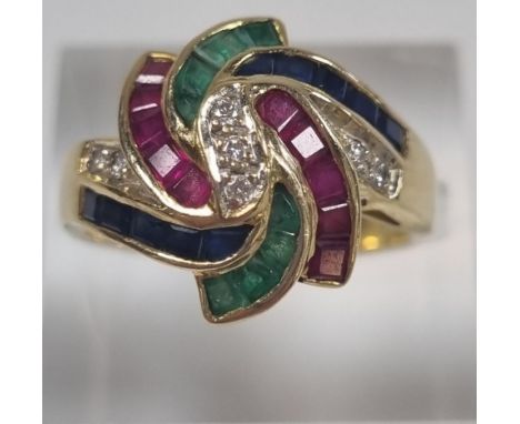 18ct gold modernist design ruby, sapphire, emerald and diamond ring, marked 750.  5.2g approx.  Size O.  (B.P. 21% + VAT) 