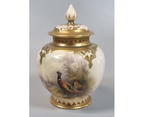 Royal Worcester porcelain potpourri vase and pierced cover, the body hand painted with a brace of pheasants, signed James Sti