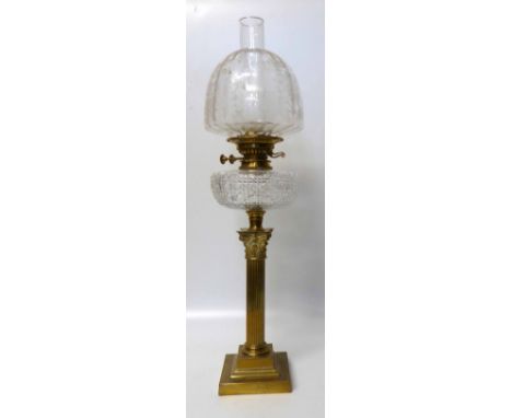 Oil Lamp with brass corinthian column, cut glass reservoir and acid etched globe No conditions reports for this sale.