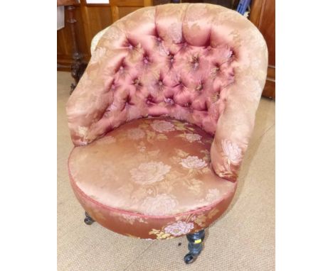Victorian button-back tub chair on ebonised legs. No conditions reports for this sale.