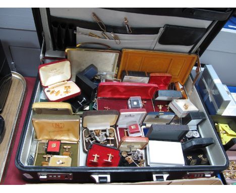 A Large Quantity of Gent's Cufflinks, tie pins and tie slides, including boxes, with a gent's brief case.