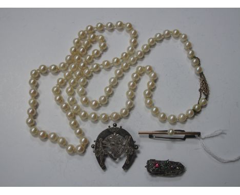 A Single Strand Uniform Pearl Bead Necklace, to pierced clasp stamped "9ct"; a hallmarked silver Aesthetic style brooch of ho