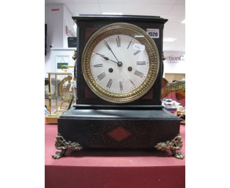 A XIX Century Black Slate Mantel Clock, with stepped cornice, circular enamel dial with Roman numerals, lion mask handles, on