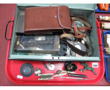 An Ensign Selfix Camera, shooting medals in a tin box, gilt metal pocket magnifier, boy scout belt, green glass eye bath, etc