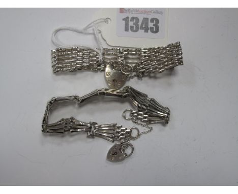 A Gate Link Style Bracelet, to hallmarked silver heart shape padlock clasp; together with another bracelet. (2)