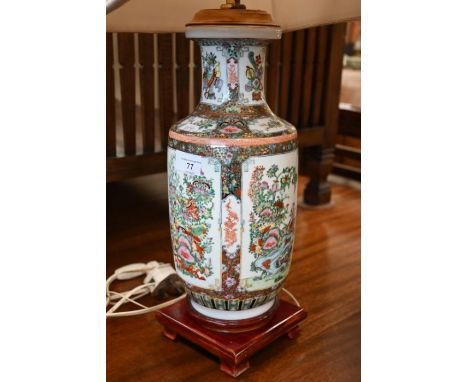 An Oriental porcelain table lamp, decorated in the Cantonese manner, on wooden base, 40cm high, with adjustable brass pillar 