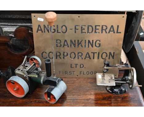 A Mamod steam roller (unboxed) to/w a toy singer sewing machine and a brass-business plate 'Anglo-Federal Banking Corporation