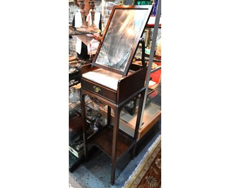 A 19th century campaign style vanity dressing stand, with adjustable easel mirror over a marble top and frieze drawers, raise