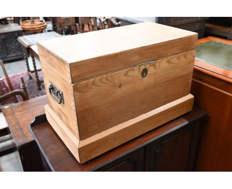 A small pine trunk with painted interior and metal handles, 58 cm w x 37 cm d x 40 cm&nbsp;&nbsp;