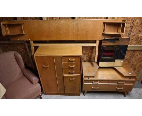 A 1950's G-Plan Brandon light oak bedroom suite comprising compactum 90 cm w x 45 cm d x 122 cm h, mirror-backed dressing tab