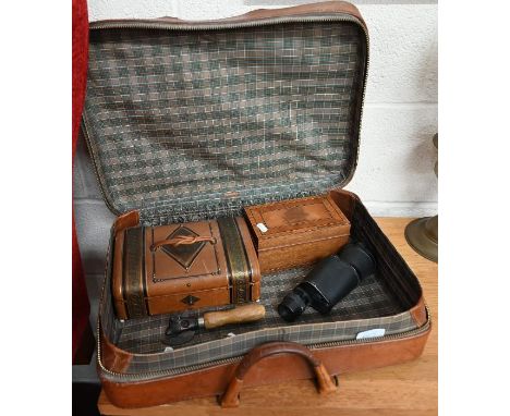 A Victorian embossed leather sewing box with brass mounts, the interior fitted with four mother-of-pearl mounted thread-spool