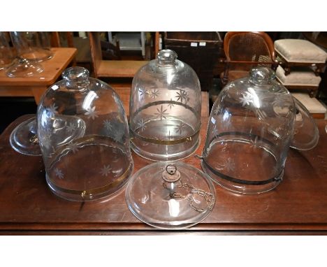 A trio of vintage starburst cut glass hundi style pendant light shades with engraved brass collars, dome height 29 cm x dia. 