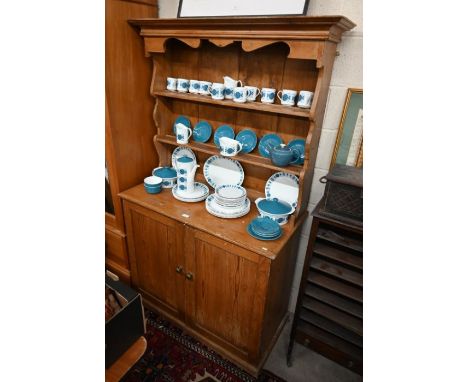 A small stained pine dresser with two-shelf plate rack on base with panelled cupboard doors, 107 cm w 51 cm d x 185 cm h&nbsp