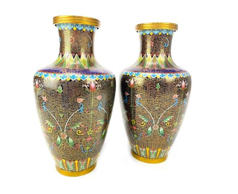 PAIR OF 20TH CENTURY CHINESE CLOISONNE ENAMEL VASES, decorated with stylised florals on a ground of spiral designs, 32.5cm hi