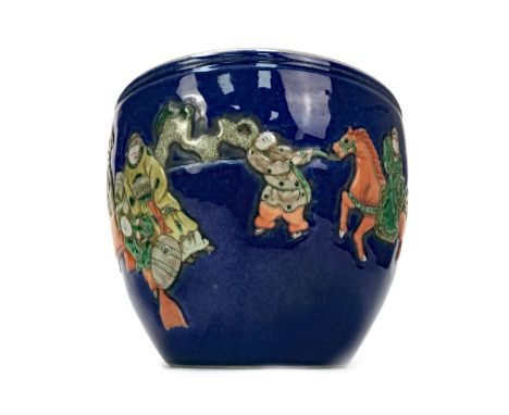 20TH CENTURY CHINESE STONEWARE PLANTER, painted with figures at a table and on horseback in relief on a blue ground, painted 