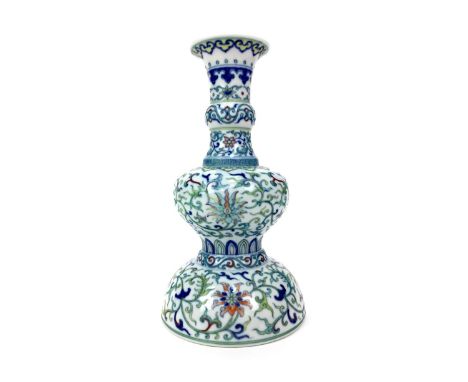 EARLY 20TH CENTURY CHINESE VASE, of baluster form with a domed base, painted allover with scroll and foliate designs in polyc