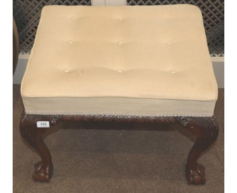 A George III Style Carved Mahogany Dressing Stool, late 19th century, recovered in buttoned beige fabric, the carved seat rai