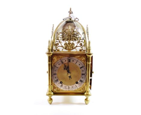 A Brass Lantern Form Quarter Striking Mantel Clock, early 20th century, scroll pierced frets, four posted case with back and 