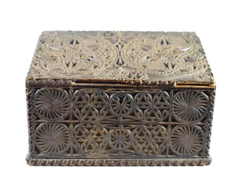 A Chip Carved Oak Casket, in 17th century style, the hinged sloping top enclosing a gilt metal coat of arms over a secret com