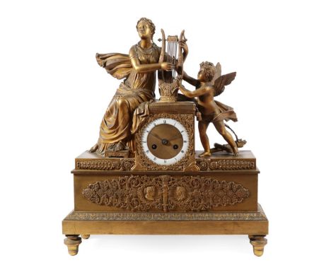 An Ormolu Empire Style Mantel Timepiece, circa 1860, case surmounted by a lady in robes holding a lyre next to a winged cheru