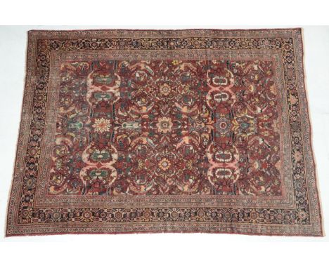 Mahal Carpet West Iran, circa 1920 The fox brown field of large serrated leaves and flowerheads enclosed by samovar motif bor