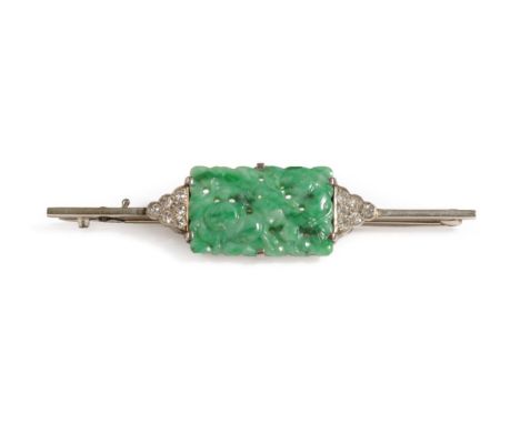 An Art Deco Jade and Diamond Bar Brooch, the oblong pierced jade depicting fruits, with a triangular cluster of round cut dia