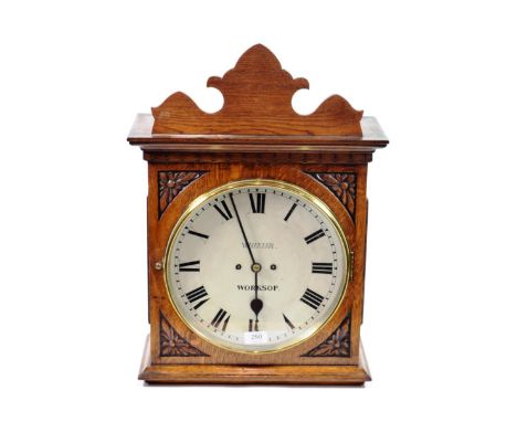 An Oak Striking Wall Clock, signed Wheeler, Worksop, circa 1880, front covers with carved floral decoration, side doors, 12-i