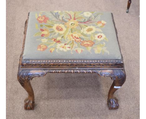 A Chippendale Revival Carved Mahogany Dressing Stool, late 19th century, with floral needlework drop-in seat above an egg and