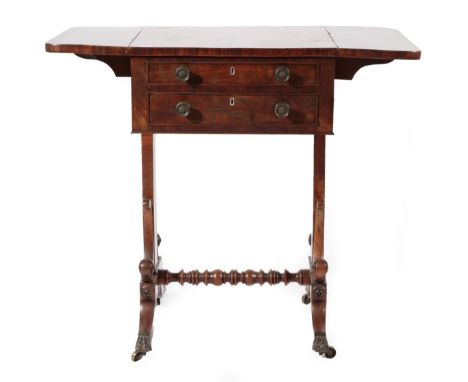 ~ A Regency Mahogany and Crossbanded Writing Table, early 19th century, with two rounded drop leaves above two real and two o