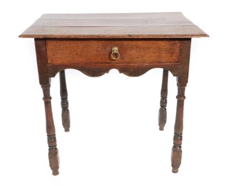 ^ An Early 18th Century Oak Side Table, the top of plank construction above a single frieze drawer and wavy shaped apron, on 