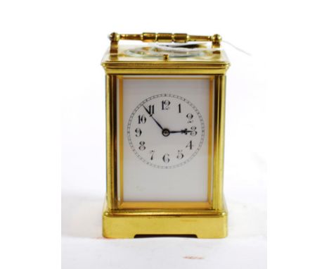 {} A Brass Striking and Repeating Carriage Clock, circa 1900, carrying handle and repeat button, enamel dial with Arabic nume
