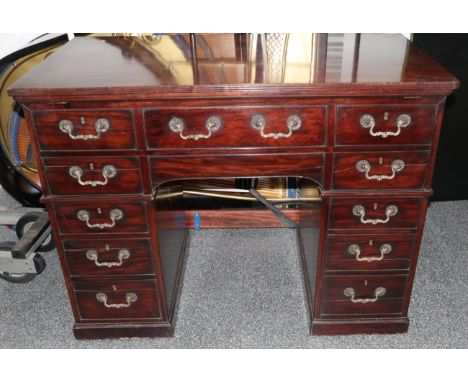 A George III Mahogany Pedestal Writing/Architect's Table, after a model by Gillows, early 19th century, the pivoting top supp