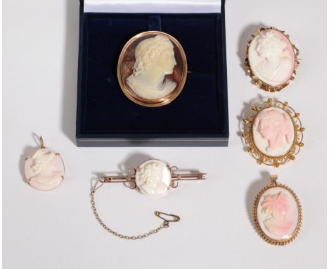 Five Cameo Brooches, one depicting Apollo in an oval frame, measures 4.2cm by 5.2cm, four other smaller cameo brooches, one a