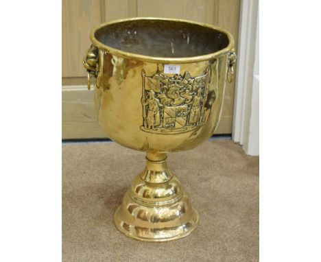 A 19th Century Dutch Style Brass Pedestal Log Bin, with lion mask handles, decorated with a coat of arms, 40cm high by 57cm w