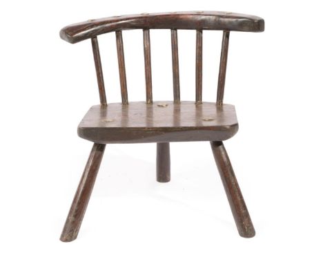 A Child's Primitive Stick Back Chair, the curved top rail above a plain seat and three splayed legs, 40cm by 31cm by 48cm