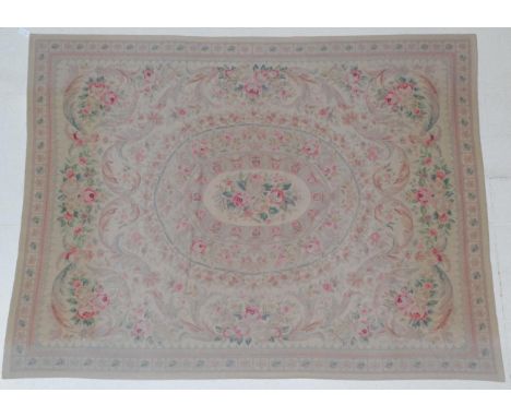 ~ Needlepoint Carpet of Savonnerie design China, late 20th century The mushroom field with central oval floral panel enclosed