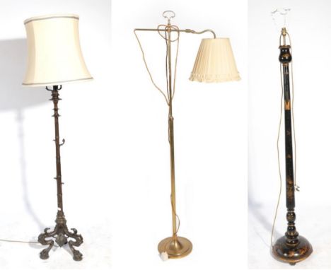 ^ A Victorian Gothic Revival Bronzed Standard Lamp, late 19th century, the circular dished top supported by three scrolled ar