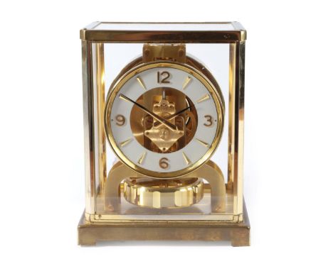 A Brass Atmos Clock, signed Jaeger LeCoultre, 2nd half of the 20th century, 4-1/4-inch white dial with Arabic and dagger mark