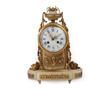 A Gilt Metal Mounted Onyx Striking Mantel Clock, signed Raingo Freres A Paris, circa 1890, urn finial, scroll and floral moun