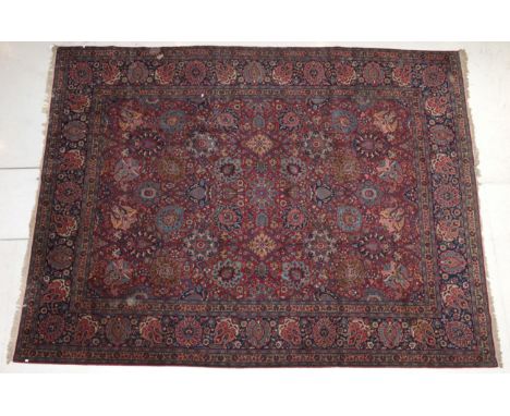 Tabriz Carpet Iranian Azerbaijan, 2nd half 20th century The crimson field with an allover design of flowerheads and vines enc