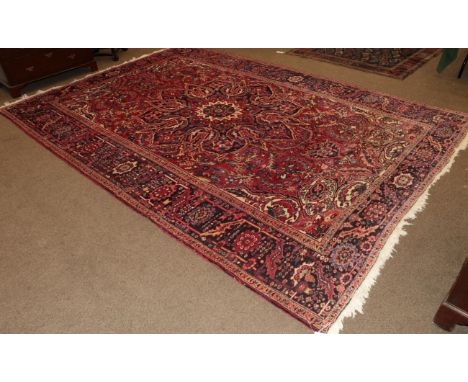 Heriz Ahar Carpet Iranian Azerbaijan, circa 1940 The strawberry field with flower head medallion framed by rosette and serrat